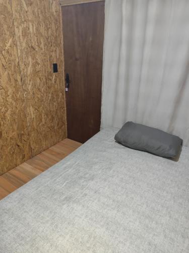 En eller flere senge i et værelse på Small house