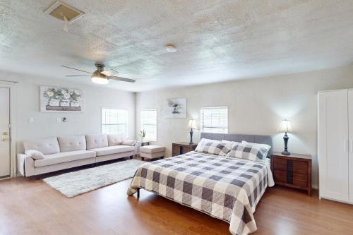 a bedroom with a bed and a couch at Quinlan Ranch 