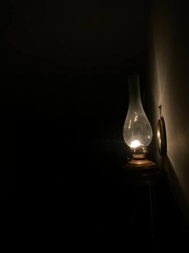 a vase sitting on a table in a dark room at Seleucia DaR Umm Qais in Um Qeis