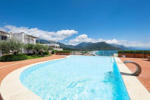 a large swimming pool with mountains in the background at Ferienwohnung für 4 Personen ca 40 qm in Villammare, Kampanien Cilento - b63223 in Vibonati