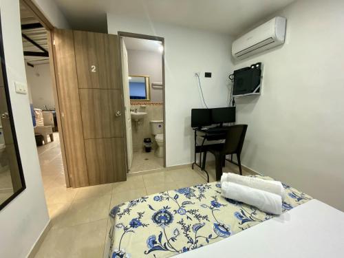 Una cama o camas en una habitación de Casa Mango