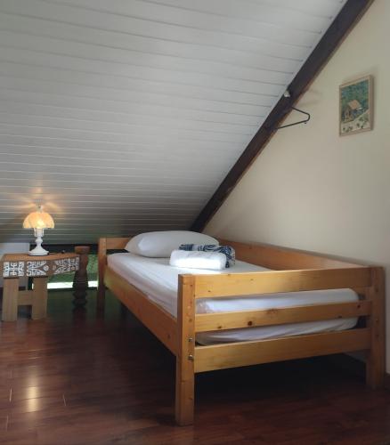 Una cama o camas en una habitación de Tema'e Beach House