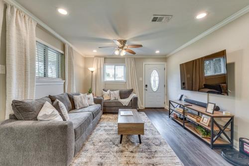 a living room with a couch and a table at Baton Rouge Home with Private Patio 2 Mi to LSU! in Baton Rouge