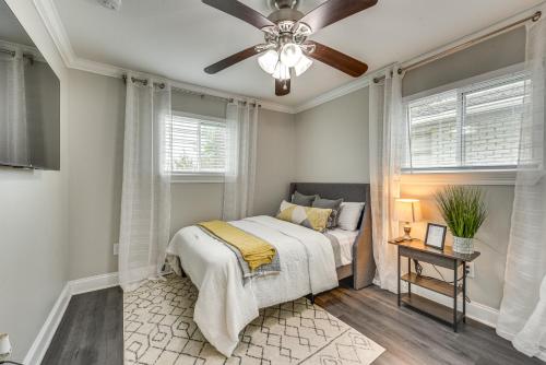 a bedroom with a bed and a ceiling fan at Baton Rouge Home with Private Patio 2 Mi to LSU! in Baton Rouge