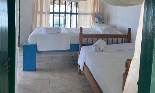 Postel nebo postele na pokoji v ubytování Hotel Puntanorte