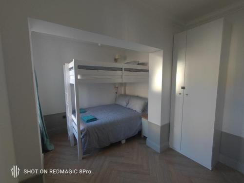 a small bedroom with a bunk bed in it at Beach Apartment, Hunstanton Norfolk in Hunstanton