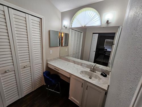 a bathroom with a sink and a mirror at Adv. Coast: 4/2, Near Springs, Beach, Big Fenced Yard in Spring Hill