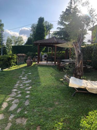a garden with a gazebo and a tree at GuesthouseAntonia in Avellino