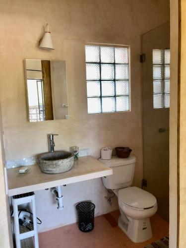 a bathroom with a sink and a toilet at Casa Taller in Lo de Marcos