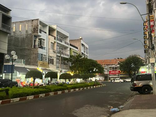 a duck laying on the street in a city at Friendly Homestay in Kon Tum