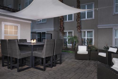 an outdoor patio with a table and chairs at Residence Inn by Marriott San Bernardino in San Bernardino