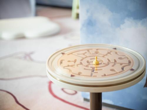 a close up of a toy clock on a table at InterContinental Shenzhen WECC by IHG in Shenzhen