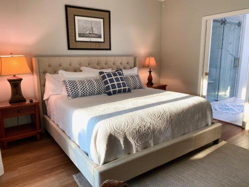 a bedroom with a large bed with pillows on it at The Moorings Condo - Wild Dunes Resort - Isle of Palms Marina in Isle of Palms