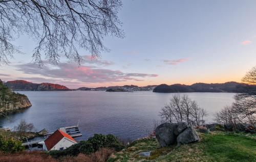 a house on the shore of a large body of water at 3 Bedroom Cozy Home In Farsund in Farsund