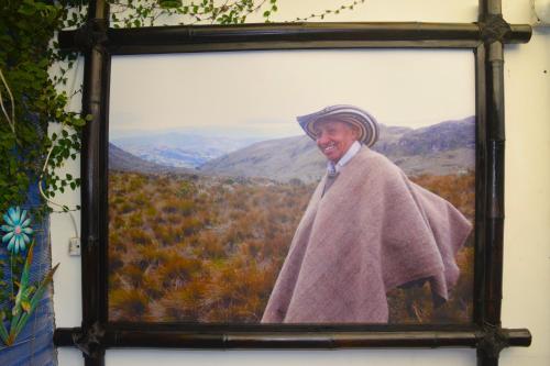 a painting of a man in a blanket on a wall at FILANDIA HOTEL in Filandia