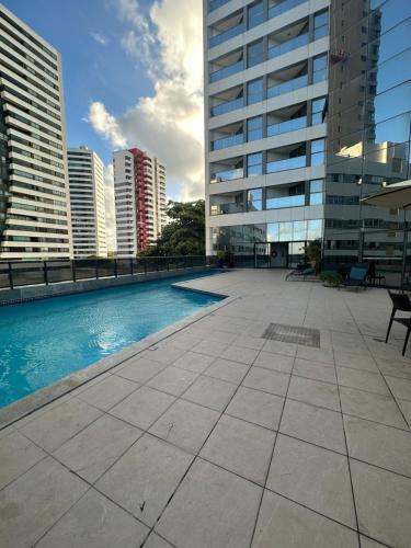 a swimming pool on the roof of a building at Recife Flats Beach Class Internacional in Recife