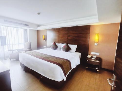 Letto o letti in una camera di Newyantai Hotel Hainan