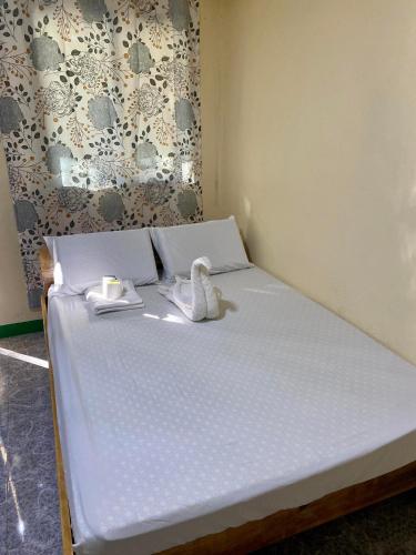 Ένα ή περισσότερα κρεβάτια σε δωμάτιο στο Noah Xye Guest House