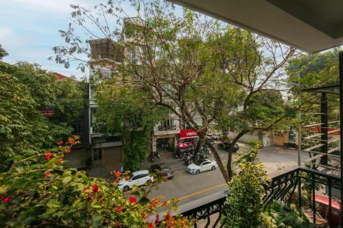 a view of a city street with cars on the road at Brilliant Nature Suites & Spa in Hanoi