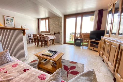 a living room with a couch and a table at 06BP - Beautiful 6-person apartment in Valberg in Valberg