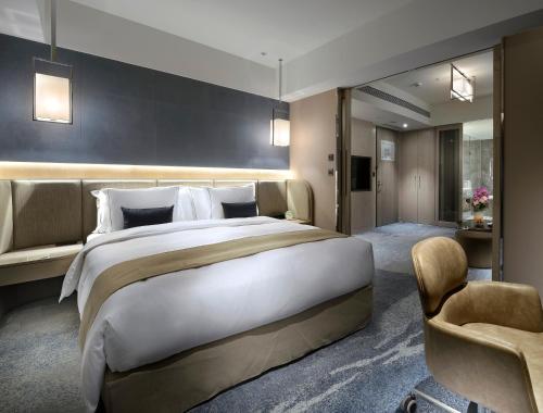 Postel nebo postele na pokoji v ubytování Caesar Park Hotel Banqiao