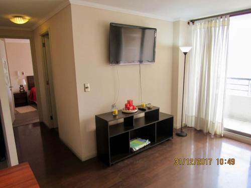 TV a/nebo společenská místnost v ubytování Gran Ubicacion, Estacionamiento y Piscina