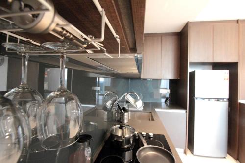 a kitchen with a sink and a counter top at Grand Medini 3 mins drive Legoland in Nusajaya