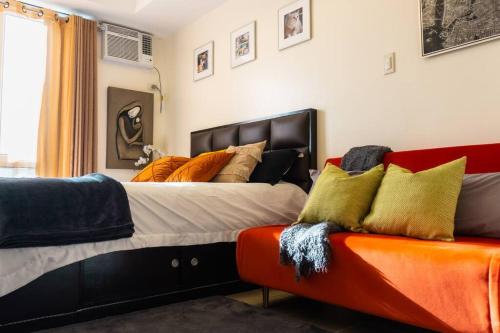 מיטה או מיטות בחדר ב-Flexi-Living Premium Condo in Kasara
