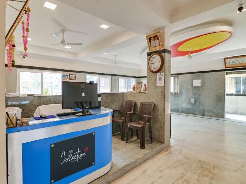 a waiting room with a computer on a counter at Hotel O Rj Royal Inn in Vellore