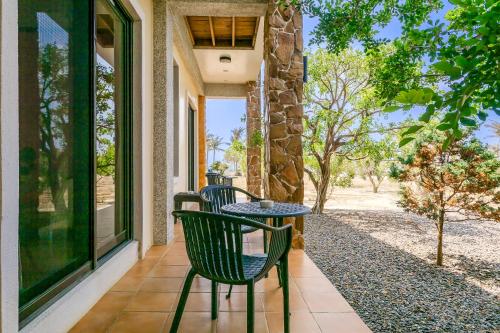 a table and chairs on the porch of a house at Southern Sun Homestay North in Kenting