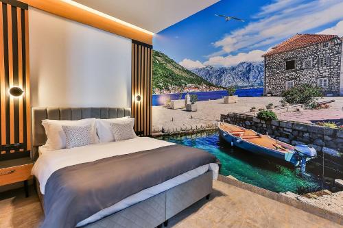 een slaapkamer met een bed en een boot in het water bij Hotel Boka in Kotor