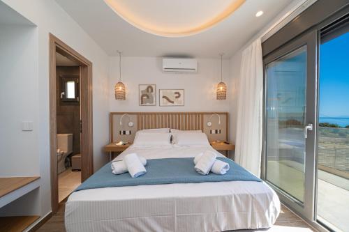 Postel nebo postele na pokoji v ubytování Endless Blue Private Club
