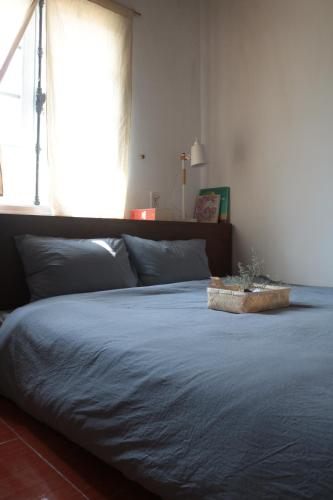Postel nebo postele na pokoji v ubytování Thịi house