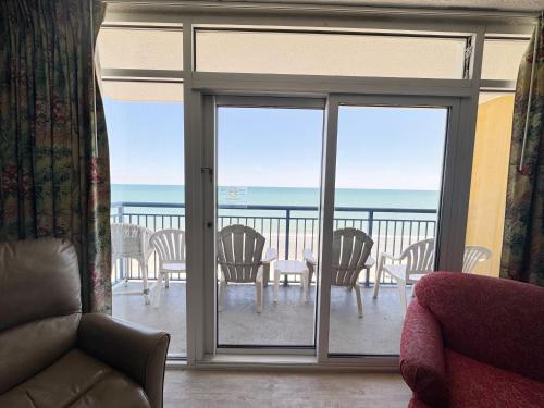 a living room with a view of the ocean at Atlantica Resort Condo Oceanfront Close to the beach in Myrtle Beach