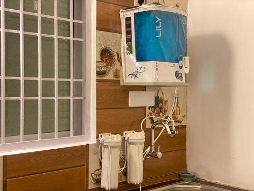 a kitchen with two white appliances in a wall at Le Poshe Luxury - TIE Hotels & Resorts in Puducherry