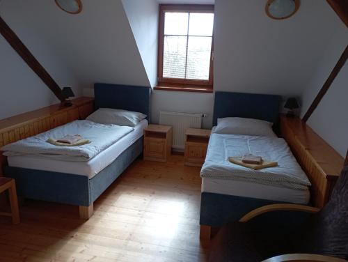 Postel nebo postele na pokoji v ubytování Ubytování na Hájence