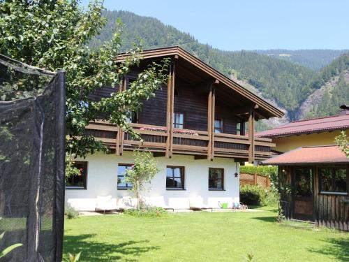 a large house with a lawn in front of it at Quaint Mansion near ski bus in Goldegg in Goldegg