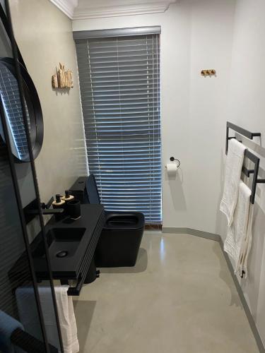 Ένα ή περισσότερα κρεβάτια σε δωμάτιο στο Luxury Upmarket Guesthouse 20 on 4th