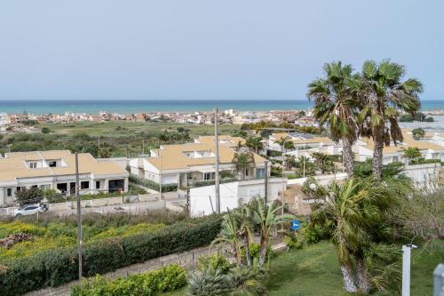 an aerial view of houses and the ocean at Sikelika Residence Sul Mare in Scoglitti