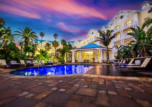 a hotel with a swimming pool in front of a building at Hemingways Hotel in East London