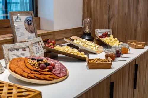a table topped with different types of food and snacks at Seth Port Ciutadella in Ciutadella