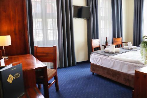 Postel nebo postele na pokoji v ubytování Hotel Piast Wrocław Centrum