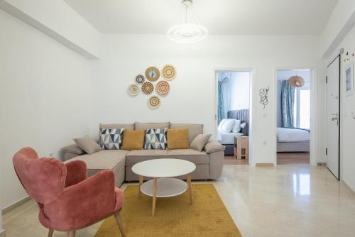 a living room with a couch and a table at Kastela's Harbor Retreat with Jacuzzi in Piraeus