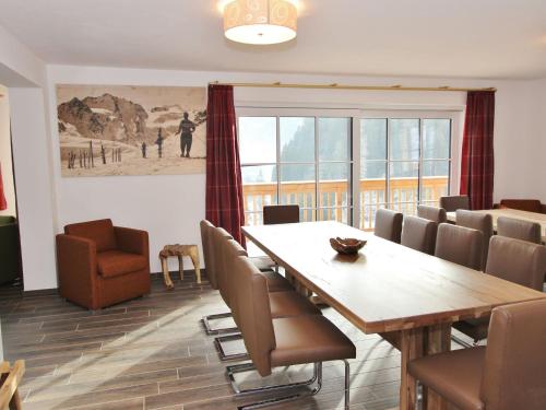 a dining room with a table and chairs at Modern chalet with sauna near ski area in Saalbach Hinterglemm Salzburgerland in Saalbach-Hinterglemm