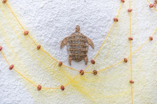 a figurine of a turtle on a white wall at Kastela's Harbor Retreat with Jacuzzi in Piraeus
