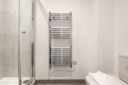 a bathroom with a shower stall and a toilet at Comfortable Studio Apartment in Central Doncaster in Doncaster