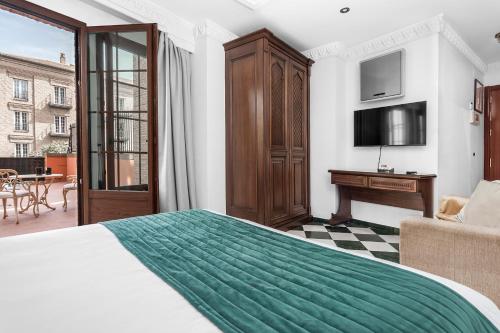 Televisyen dan/atau pusat hiburan di Hotel Boutique Las Almenas by Maxi Hoteles
