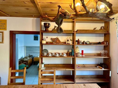 a room with shelves with antlers on the ceiling at Rakousy22 in Rakousy