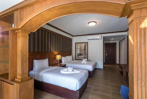 Postel nebo postele na pokoji v ubytování Le Erawan Phang Nga Hotel