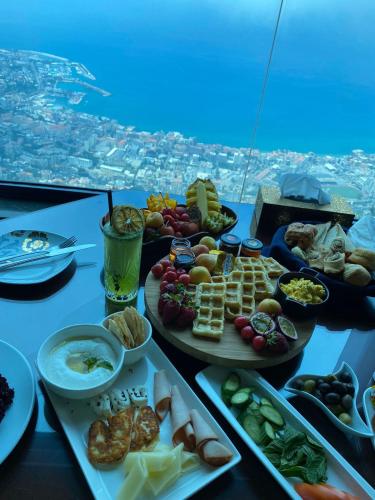 a table topped with plates of food on top of an airplane at Bay Lodge Boutique Hotel in Jounieh